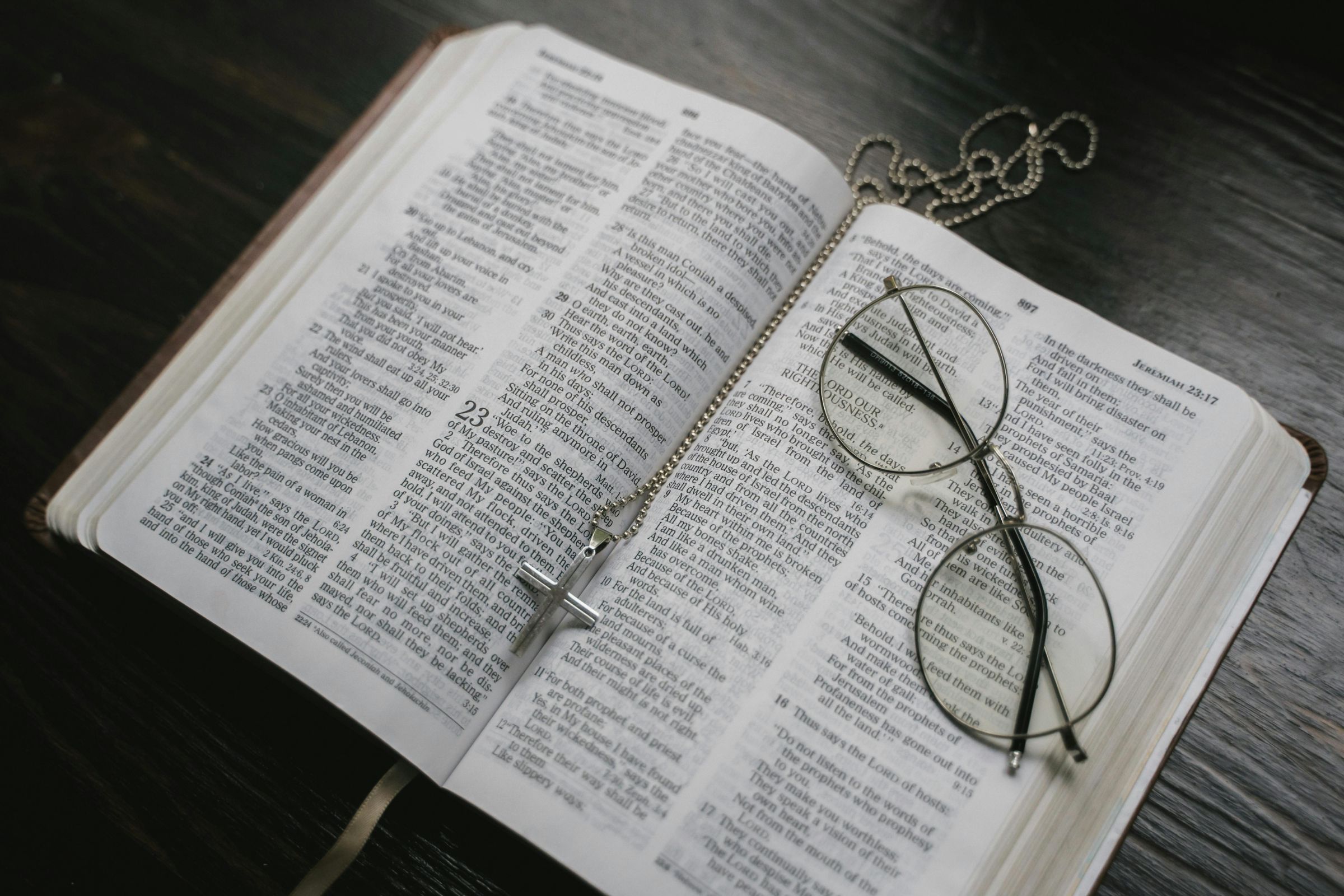 Open Bible with Rosary and a pair of reading glasses