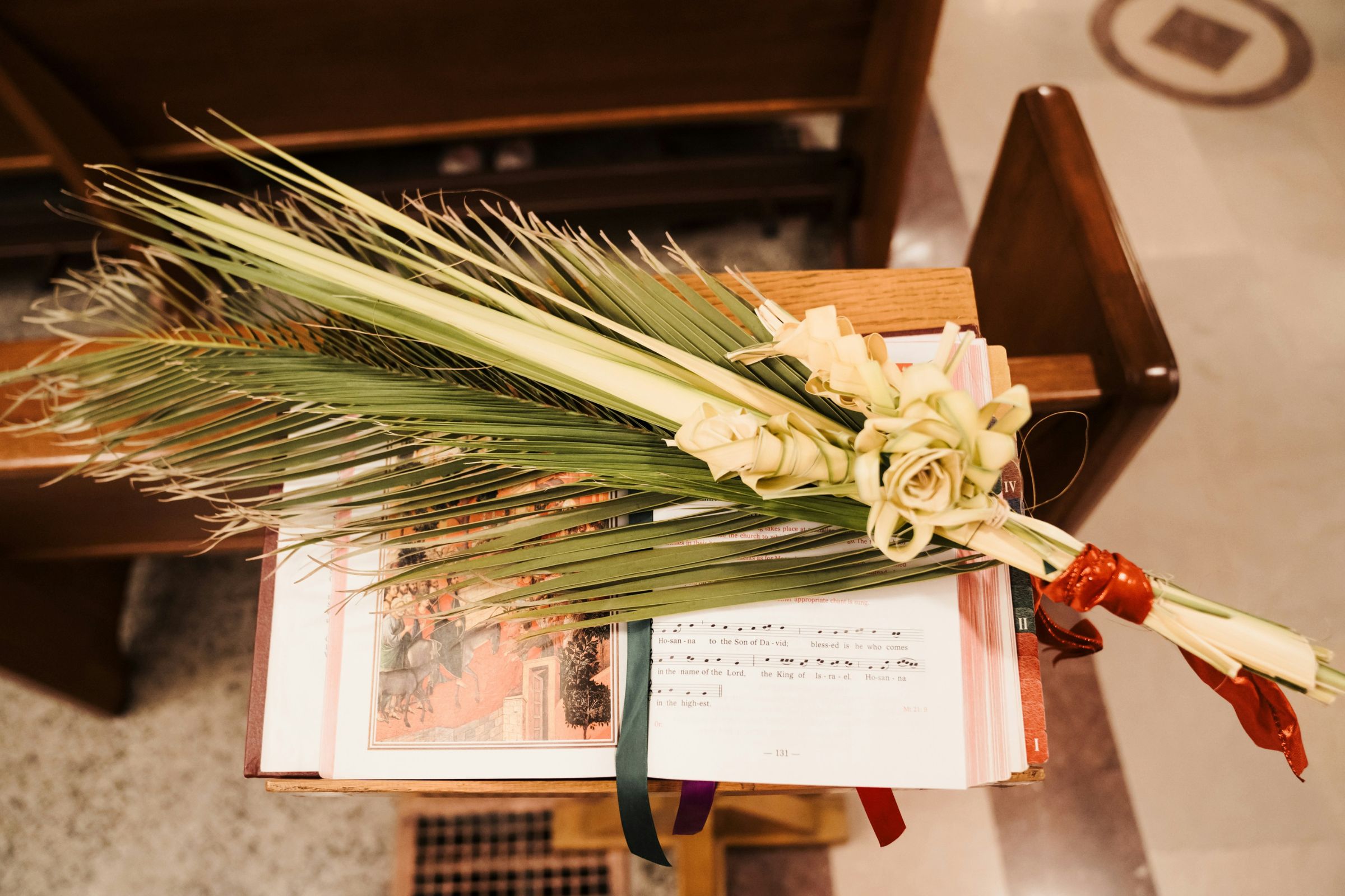 Palm branches on an open hymnal in church