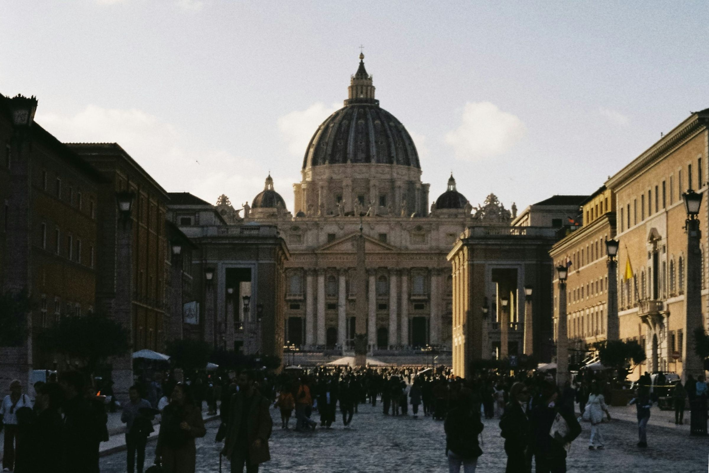 St. Peter's Basilica in the background with crowds of people in the foreground
